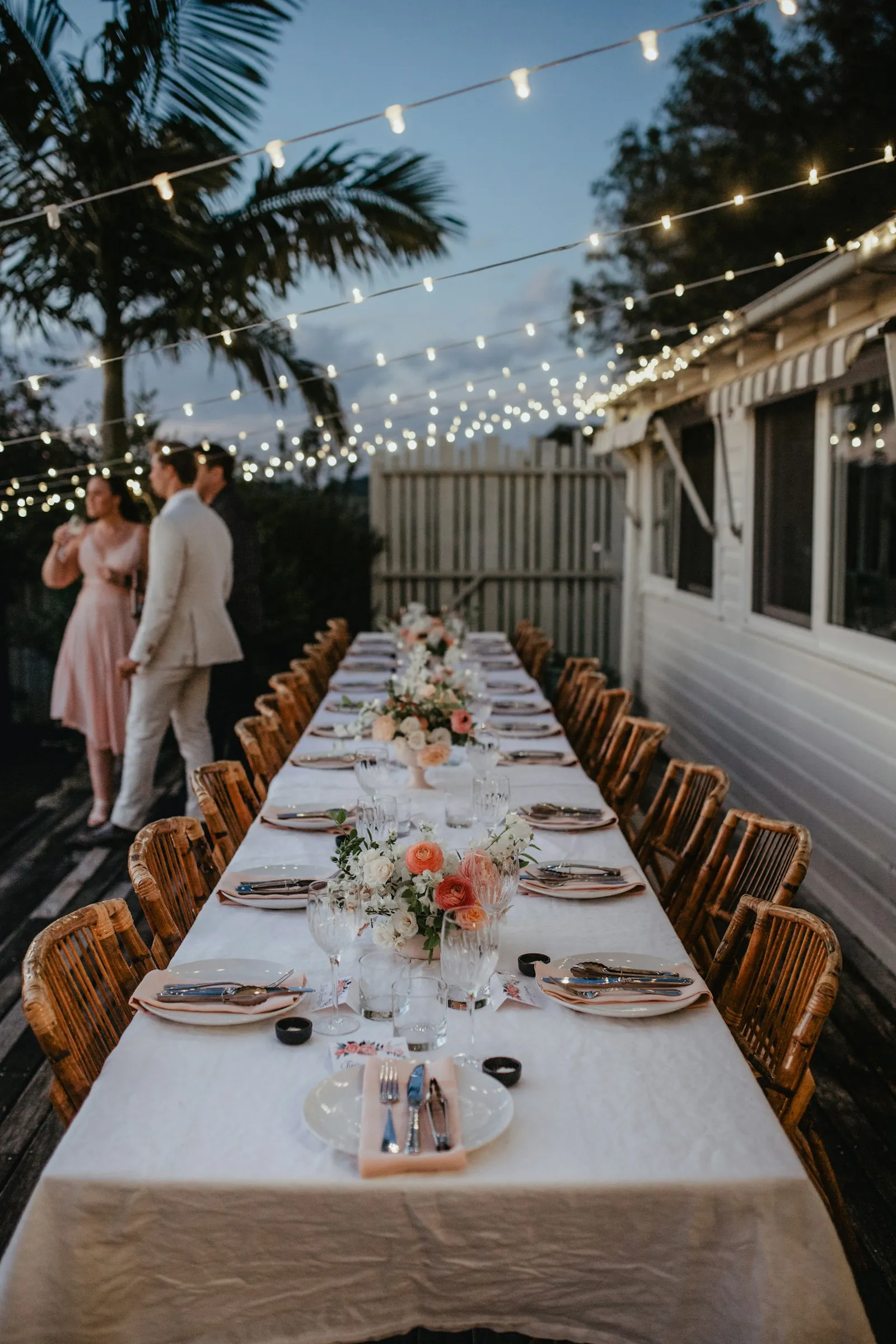 [REPLACE: Lory and Devon at a styled table]