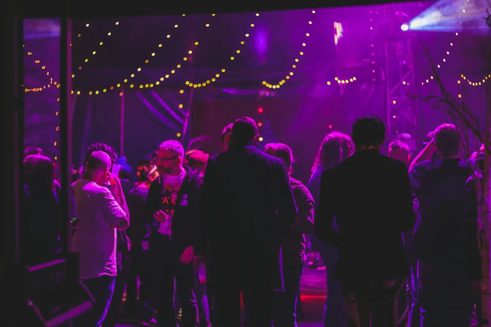 Guests on a lit dance floor