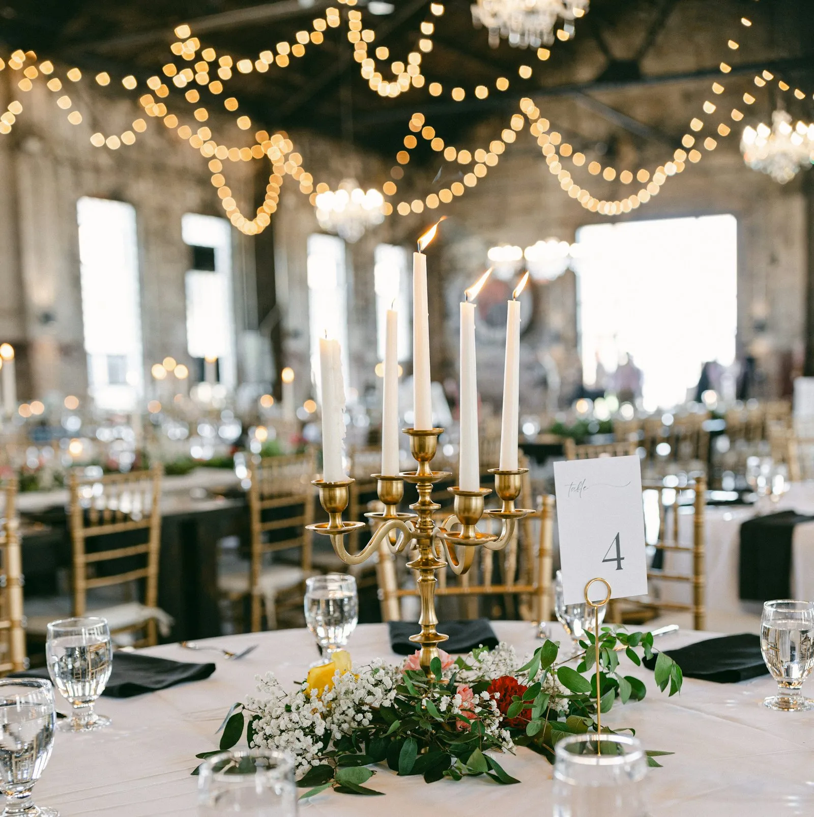 A reception room set and lit warm, ready for guests