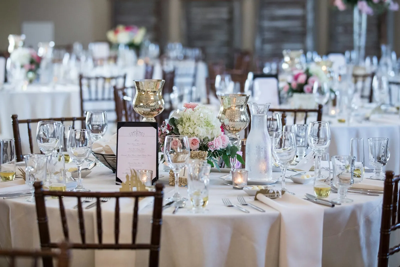 Full tablescapes for every round, a styled head table, uplighting and a ceremony arch.