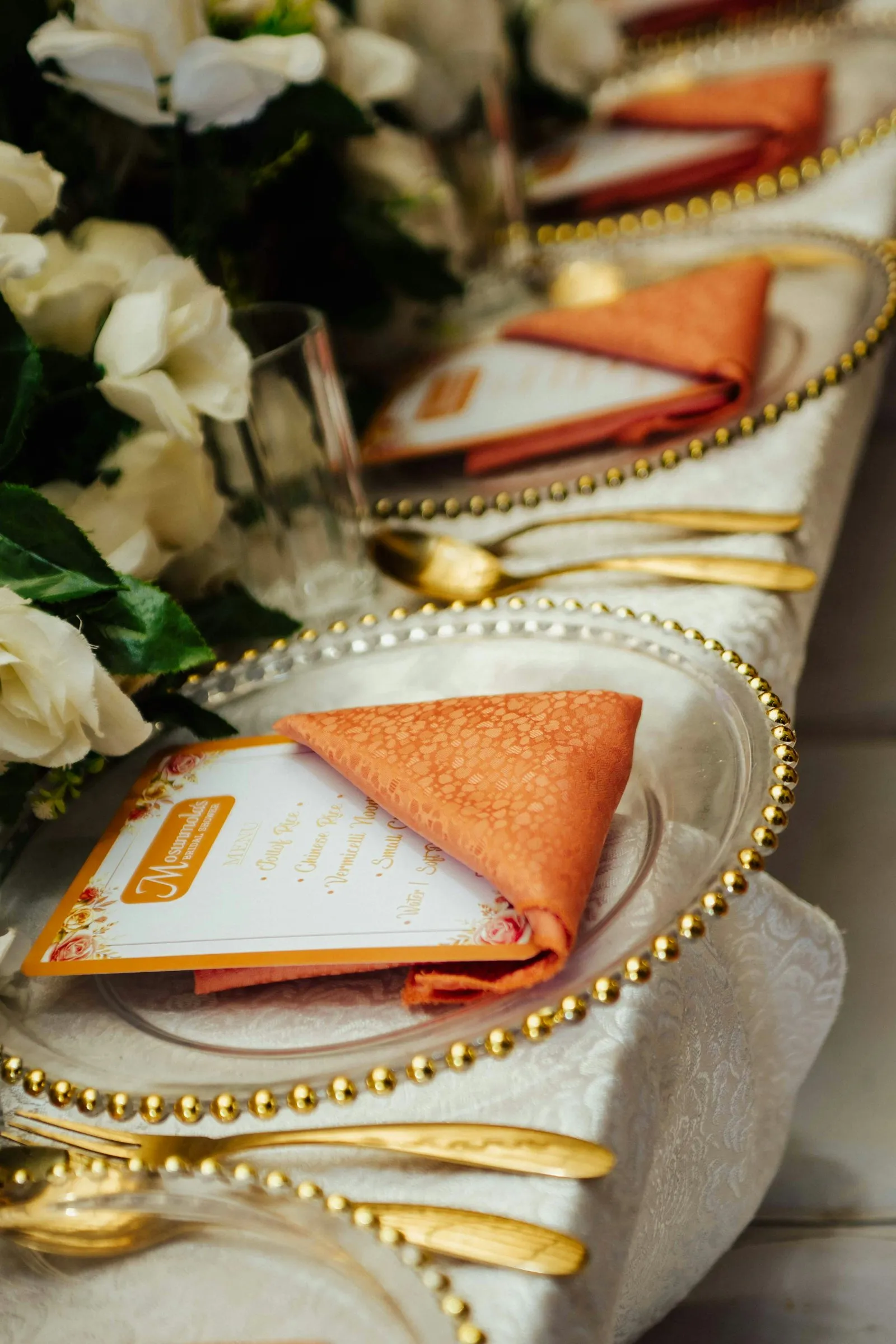 Terracotta napkin on a gold charger